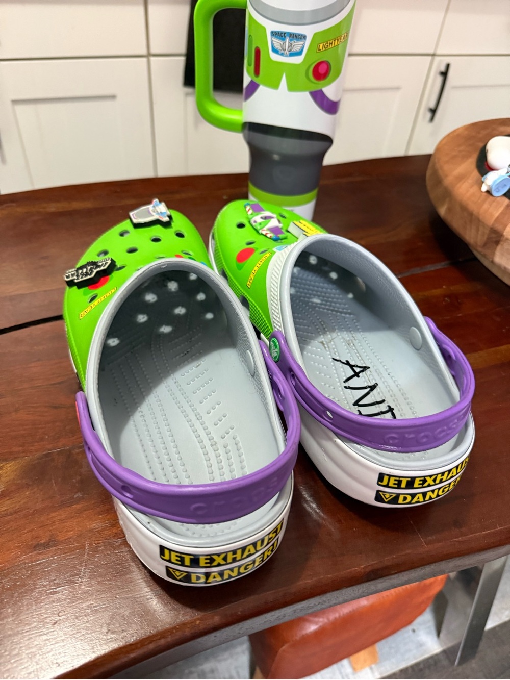 Men’s Buzz Lightyear crocs with matching tumblr from Disney.